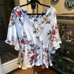 Flower top with bell sleeves. Fits like a 22